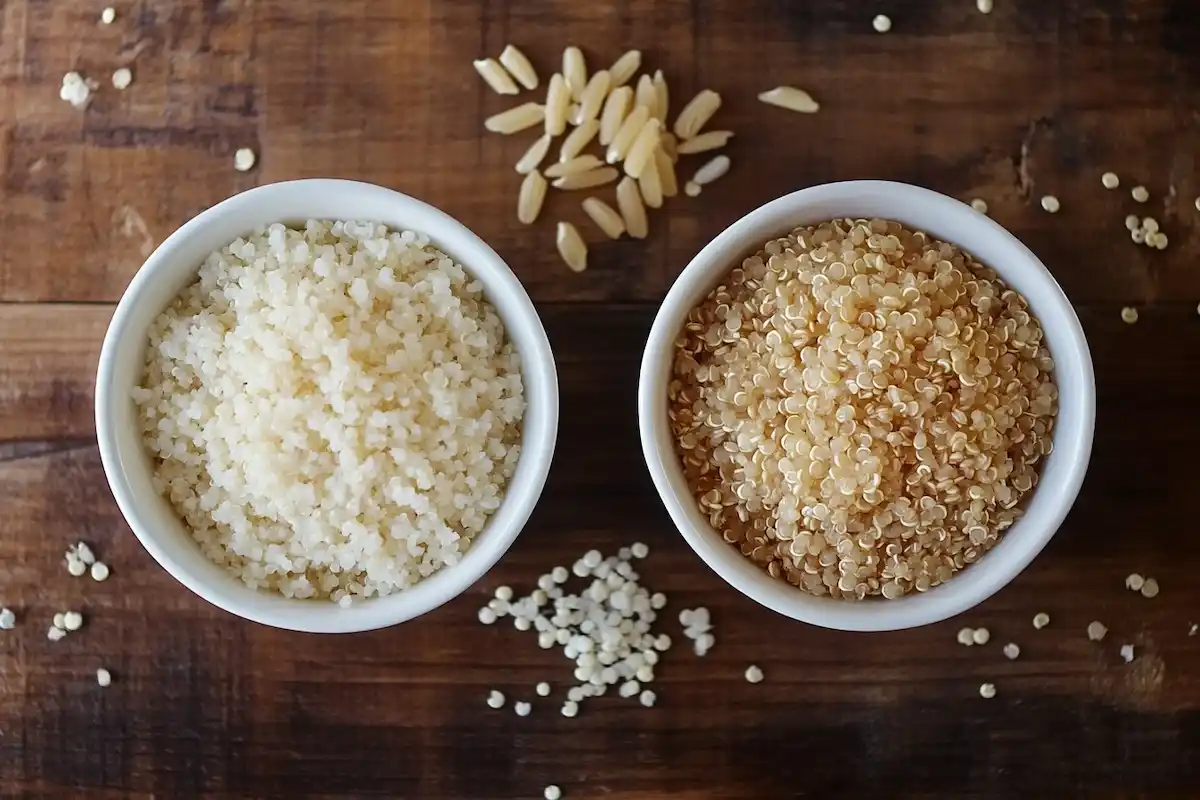 Side-by-side comparison of cooked quinoa rice and brown rice.